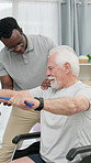 Physiotherapy, resistance band and elderly man in wheelchair for mobility, wellness and healing. Health, physical therapist and person with disability stretching for shoulder pain, strength and help