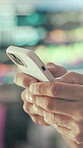Person, hands and typing with phone in control room for communication, schedule or chatting. Closeup, security or employee texting with mobile smartphone for app, cybersecurity or safety protocol