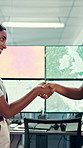 Partnership, geospatialist or people in control room with handshake, welcome or meeting for collaboration. Smile, team or geoanalyst with shaking hands, agreement or introduction in operations center