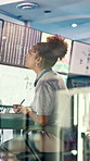 Woman, weather and monitor with writing for info, digital analysis or notes for forecasting at office. Person, ui and satellite on tech, data or screen with book, storm development and meteorology