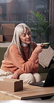 Remote work, coffee and mature woman on laptop for supply chain, dropshipping and online orders. Small business, home and senior person with drink, beverage and break on computer for ecommerce sale