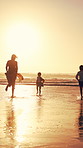 Parents, children and running at beach, sunset and waves with bonding, fun and splash on summer vacation. People, girl kids and outdoor with play, sunshine or space for seaside holiday with family