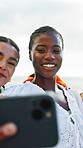 Happy, women or beach with friends for selfie, outdoor memory or photography together. Female people, group or smile with hug on ocean coast for picture, capture moment or social media post in nature