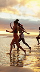 Sunset, running and friends by ocean for holiday, tropical destination and summer break for adventure. Island vacation, travel and people with weekend trip for bonding, seaside getaway and freedom