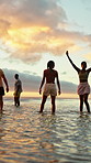 Sunset, walking and friends in sea for holiday, tropical destination and summer break for adventure. Island vacation, travel and people with weekend trip for bonding, coastal getaway and freedom