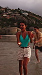 Sparklers, excited and group of friends by beach for summer vacation, getaway or weekend trip together. Fireworks, travel and people by ocean for adventure on seaside holiday with social gathering.