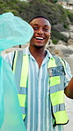 Face, beach or happy man with bag for recycling, cleaning dirt or pollution on sandy shore together. Male person, volunteer or group with smile or garbage for community service, success or earth day