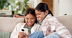 Children, sister and laugh with phone on sofa for bonding, funny video and relax with streaming in home. Kids, girl and happy with mobile app, games or social media in living room at family house