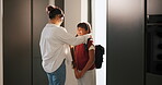 Home, mom and child with backpack, education and family with smile for morning routine and together. Fixing, hair and happy woman with daughter in kitchen, bonding and getting ready for school
