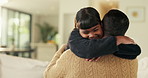 Father, daughter and hug in living room with smile, bonding together and support for child development. Happy, girl and dad in home with embrace, family connection and parent care on weekend break.