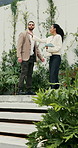Tablet, client and realtor with garden tour for property features, assessment or information. Tech, real estate agent and man in discussion in backyard for private viewing, house inspection or update