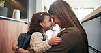 Mom, girl and hug in home with bag for back to school, kindergarten and motivation with forehead touch. Happy people, mother and daughter with embrace, support and backpack in kitchen at family house