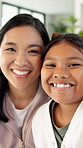 Happy, mother and kid in house with face, healthy relationship or bonding together for child growth. Laugh, support or Asian family with smile, childcare or parent connection in childhood development