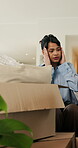 Boxes, home and woman with stress for eviction, think and frustrated with financial crisis and debt. Unhappy, tenant and person with depression, reflection and anxiety for lease termination or moving