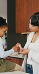 Bandage, help and mother with daughter in kitchen of family home for injury, first aid and support. Love, healthcare and plaster with woman and child in house for accident, wound care and treatment