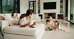 Mom, children and discipline with tablet in home for obedience, parenting or control. Mother, siblings and stop with argument, fight or disagreement on technology in living room dispute for behaviour