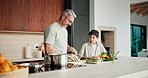 Cooking, learning and dad with child with vegetables for meal prep, lunch and recipe in kitchen. Family, teaching and father with boy with ingredients for healthy diet, nutrition and bonding in home