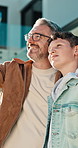 Dad, pointing and hug with child in backyard for sightseeing, outdoor bonding or bird watching. Father, kid or showing son view with smile for vision, observation or childhood memory in home garden