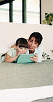 Tablet, mom and kid in bedroom for learning, relax together or storytelling with parent in morning. Tech, mother and girl in bed at home to scroll app, talk or browsing website for educational game