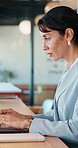 Business, woman and typing with laptop at cafe for research, court case and online evidence. Mature lawyer, freelancer or pc for witness testimony, review lawsuit and confidential information at shop