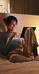 Laugh, night and woman on tablet in bed for online streaming, funny website and internet. Happy, home and person on digital tech for social networking, connection and video for humor in bedroom