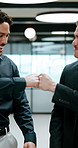 Business, men and happy with fist bump in office for verdict win, case settlement or teamwork pride. Excited, lawyers and celebration at firm for legal victory, trial success and career development