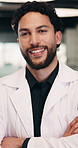 Face, man and doctor with confidence for healthcare, pride and career ambition in hallway. Smile, physician or medical professional with portrait for about us, management and support in hospital