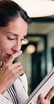Tablet, woman and doctor with thinking for telehealth, typing and review report in hallway. Reflection, physician or mature professional with tech for healthcare, management and support in hospital