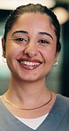 Face, woman and nurse with confidence for healthcare, pride and career ambition in hallway. Smile, physician or medical professional with portrait for about us, management and support in hospital