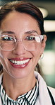 Face, woman and doctor with confidence for healthcare, pride and career ambition in hallway. Smile, physician or mature professional with portrait for about us, management and support in hospital
