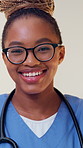 Doctor, face and black woman with smile for healthcare, cardiology specialist and career ambition. African person, portrait and happy in hospital for wellness, medical service and pride or about us