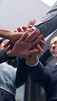 Below, business and people with handstack in office for good news, real estate success or celebration. Staff, applause and team achievement for property deal, realtor motivation and auction milestone