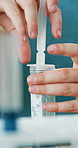 Hands, scientist and syringe with test tube at laboratory, medical research and drugs for virus cure. Person, clinical trial and pharmaceutical innovation with liquid for vaccine development project