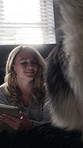 Dog, home and woman with tablet on bed, entertainment or reading ebook with subscription on website. Novel, online and happy person with tech in bedroom, chilling and bonding with pet on weekend