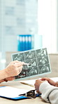 Xray, consultation and hands of doctor in hospital with medical diagnosis or treatment planning. Scan, conversation and healthcare worker in discussion for radiology results in clinic for checkup.