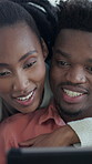 Reading, tablet and couple with hug in home for bonding, browsing internet and laugh for connection. Embrace, happy and black people with tech for movie subscription, watch funny series and support