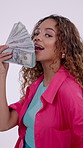 Reward, face and woman with money, lotto payout and giveaway offer in jackpot competition. Happy, portrait or female person with cash notes, contest prize or promotion campaign on studio background.