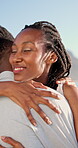 Couple, hug and happy on holiday, love and travel with partner for anniversary celebration and date. Outdoor, black people and embrace with spouse on special event, bonding and support on vacation