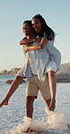 Love, laugh and black couple with piggyback on beach for summer holiday, sightseeing and bonding. Pointing, happy people and carry at seaside for romantic stroll, anniversary vacation and funny chat