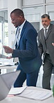 Teamwork, happy and business men dancing in office for good news on finance deal approval. Excited, documents and male financial advisors with groove for positive feedback on investment in workplace.