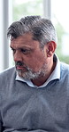 Mental health, sad or man in office with group therapy, anxiety trigger or memory of past trauma. Bokeh, employee or mature person with depression, grief or emotional fatigue in counseling session.