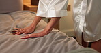 Cleaning, hands and woman making bed in home for daily routine, fresh fabric or maintenance. Change, morning and tidy with person in bedroom of apartment for chores, housework or responsibility