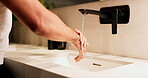Foam, sink and washing hands with man in bathroom of home for disinfection or hygiene. Basin, cleaning and soap with person in apartment to remove bacteria or germs for morning self care routine