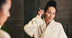 Woman, skincare and jade roller in bathroom with mirror, lymphatic drainage and calm morning routine. Person, getting ready and product in home with facial massage, reflection and blood circulation.
