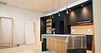 Interior design, kitchen and real estate with cover on counter in new home for renovation or upgrade. Decor, lighting and property with room in modern apartment for residential housing development