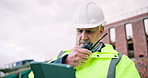 Man, tablet and radio on construction site for task brief, inspection or safety update. Industrial, communication and mature engineer with tech, progress report or project coordination for renovation