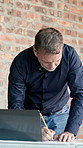 Construction site, laptop or man with writing for blueprint correction, drawing update or renovation. Tech, mature architect and notes on floor plan for building design, layout change and compliance