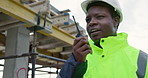 Construction, man and talk with radio on site for building inspection, hazard reporting or workflow. Project manager, black person and communication outdoor for quality control, compliance and safety