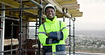 Construction, face and man with arms crossed for site safety, renovation supervision and happy. Scaffolding, black person or laugh outdoor for project foreman, building compliance or labor inspection