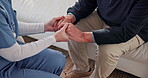 Comfort, nurse and old man in home with holding hands, understanding or empathy in elderly care. Compassion, patient or caregiver with security, retirement support and trust in medical assistance.